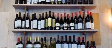 A wine rack with multiple bottles of wine.