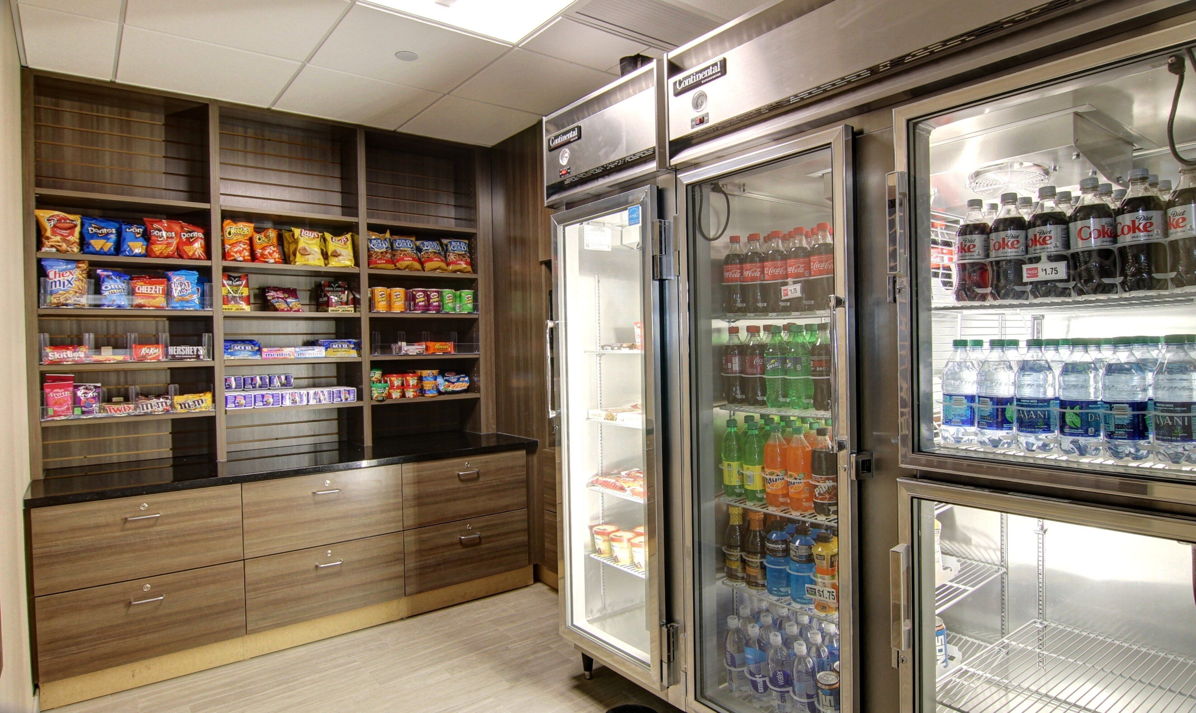 A snack and beverage refrigerator stocked with various items.