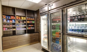 A snack and beverage refrigerator stocked with various items.