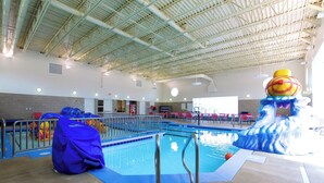 An indoor swimming pool with a high ceiling, clear pool area, and a lifeguard station. - Holiday Inn Express Fargo SW - I-94 Medical Center by IHG (Fargo)
