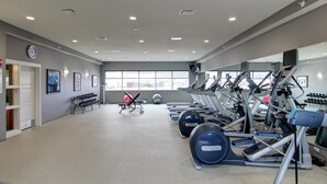 A gym with treadmills, elliptical machines, and free weights. - Holiday Inn Express Fargo SW - I-94 Medical Center by IHG (Fargo)