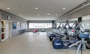 A gym with treadmills, elliptical machines, and free weights. - Holiday Inn Express Fargo SW - I-94 Medical Center by IHG (Fargo)