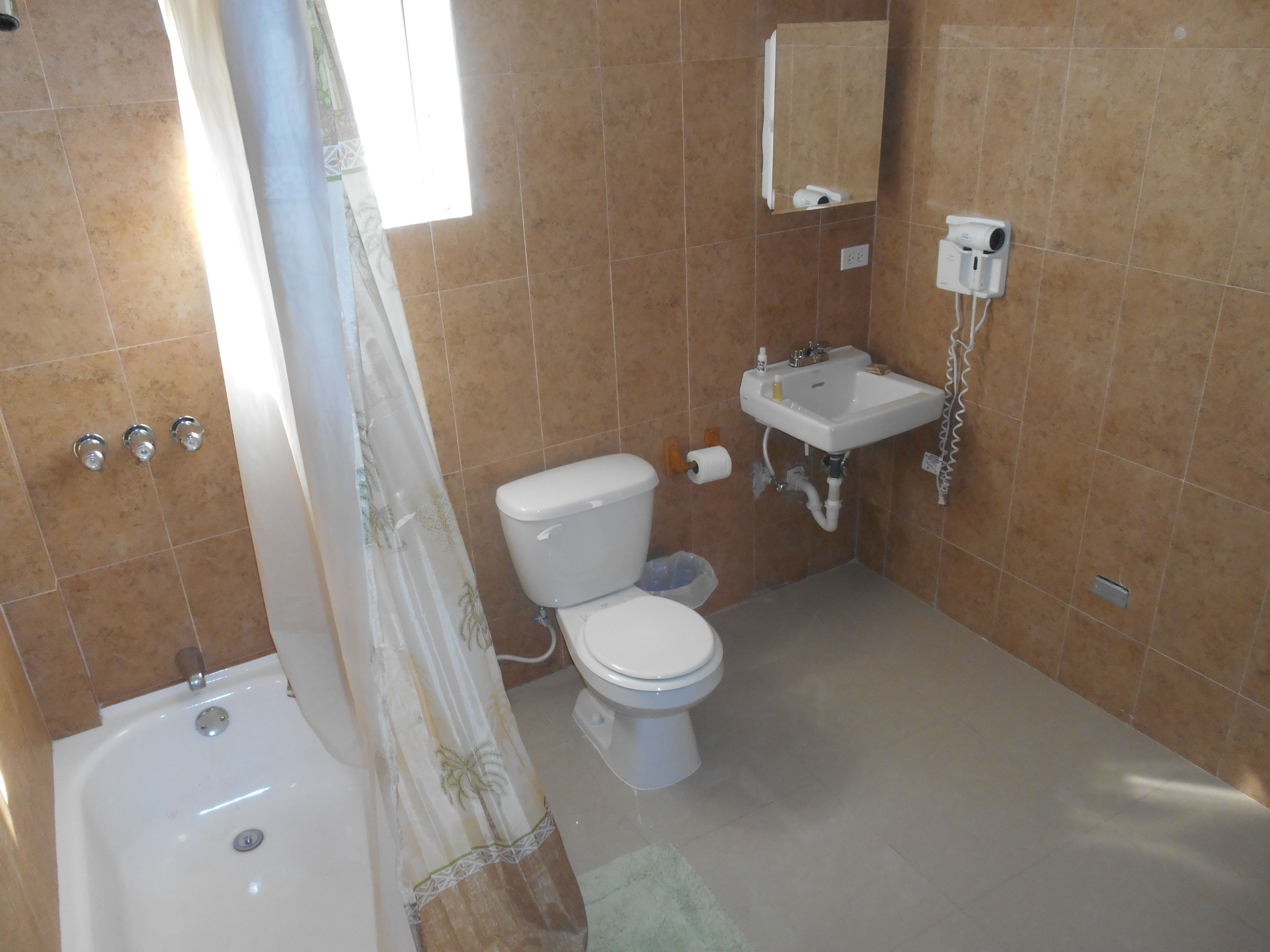 deluxe double room | bathroom | combined shower/bathtub, spring water bathtub, rainfall showerhead
