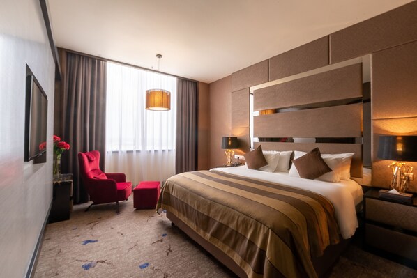 Suite | Minibar, caja de seguridad en la habitación y decoración personalizada 