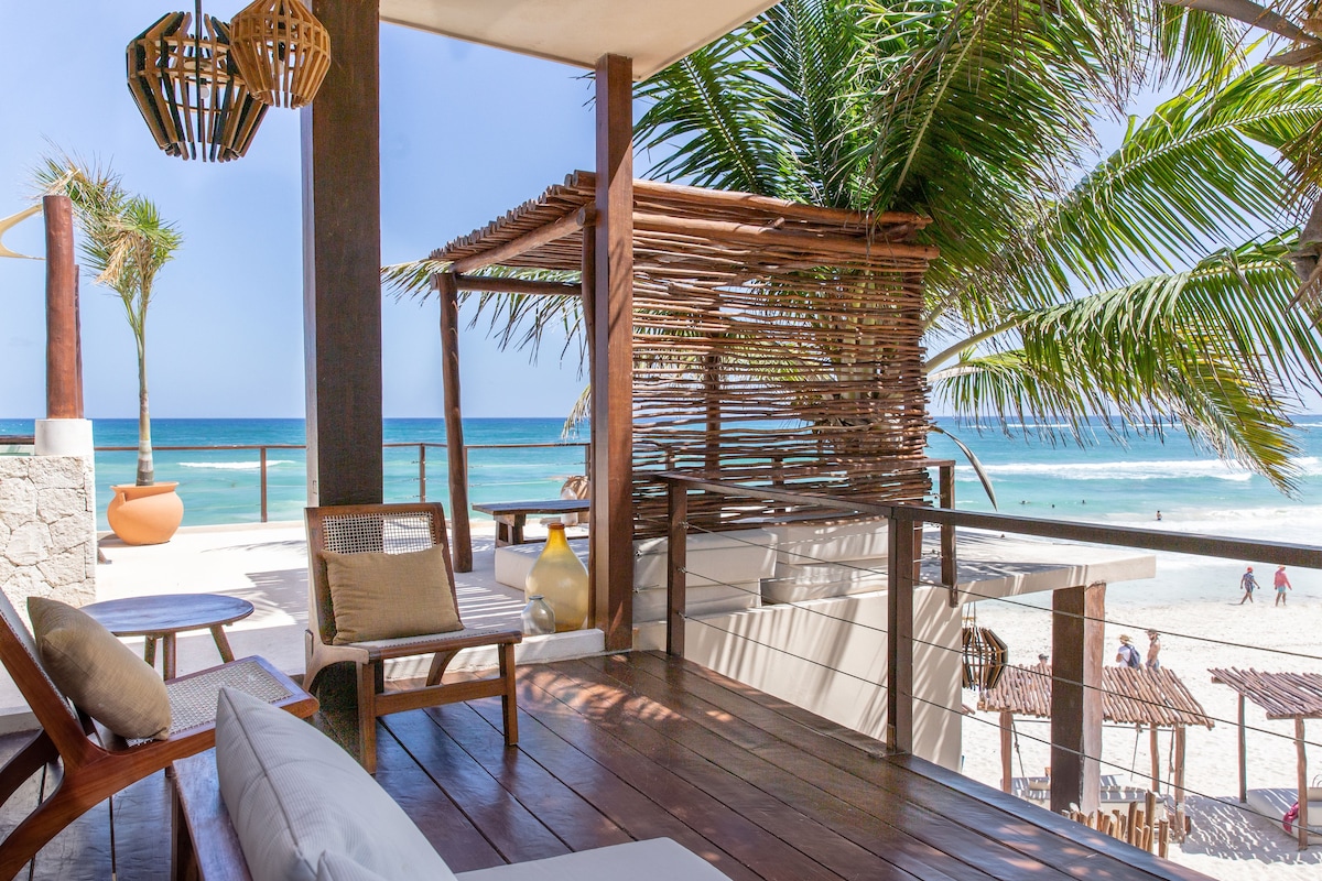 La zebra beachfront restaurant in Tulum, with lounge couches on the beach