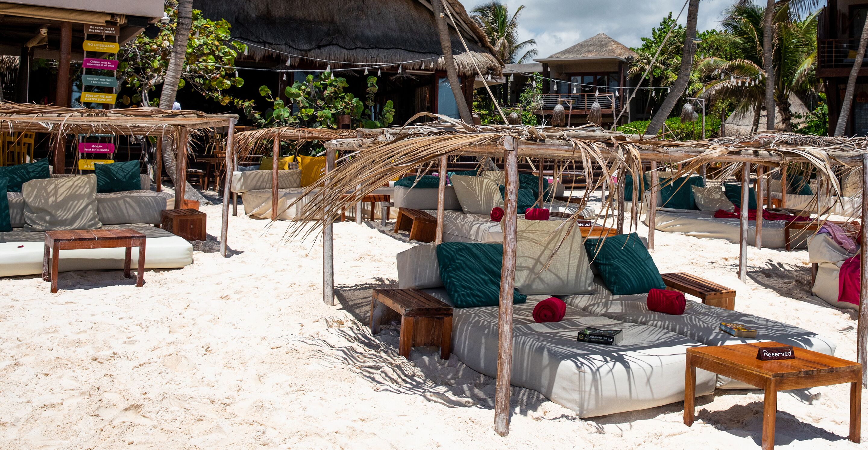 on the beach, white sand, sun-loungers, beach umbrellas