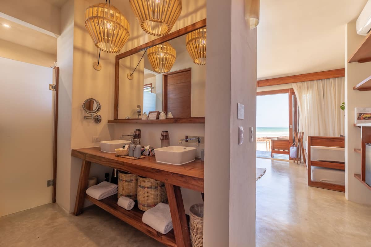 beach front ground floor suite | bathroom | designer toiletries, hair dryer, bathrobes, slippers
