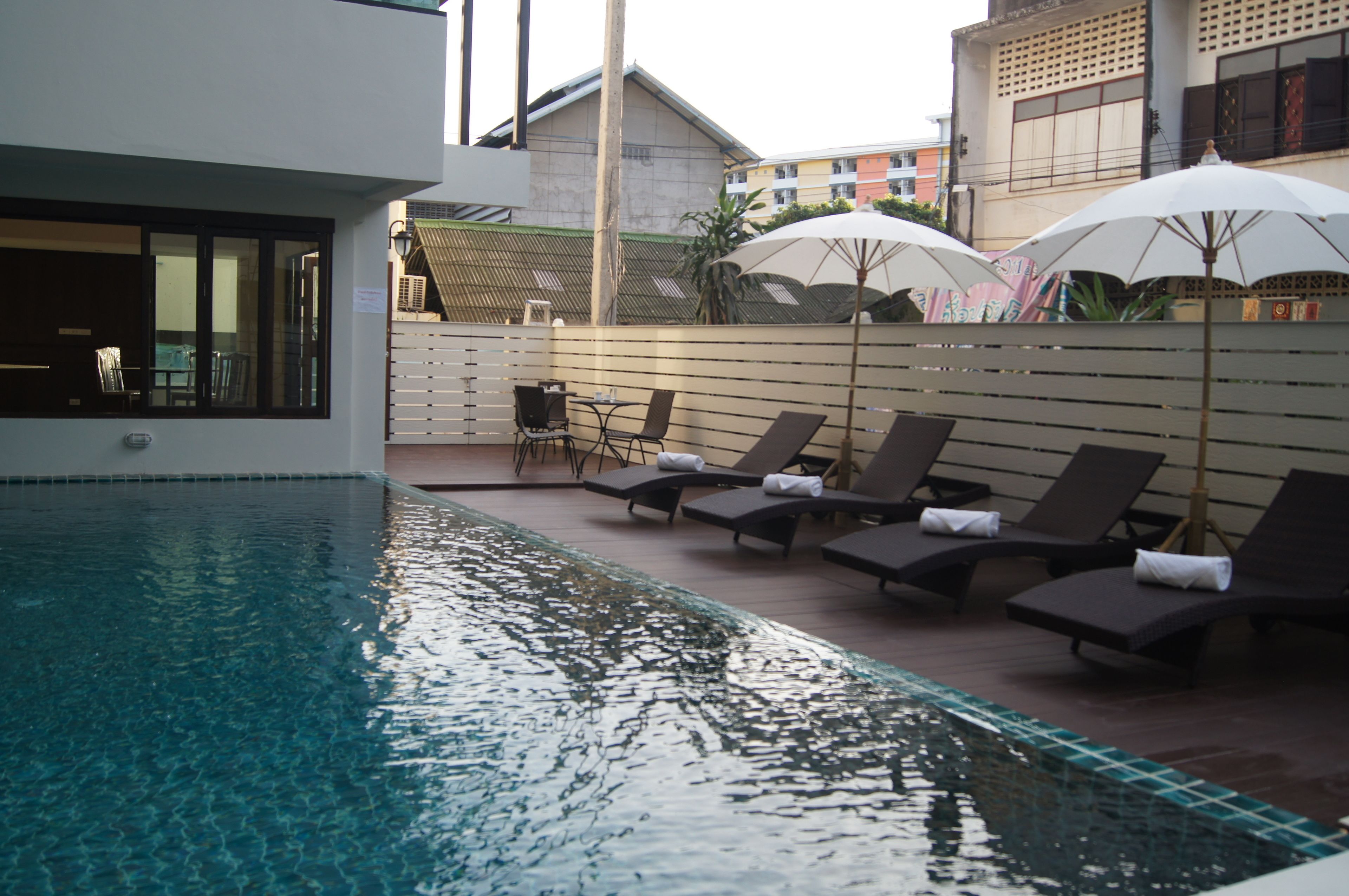 outdoor pool, pool umbrellas, pool loungers