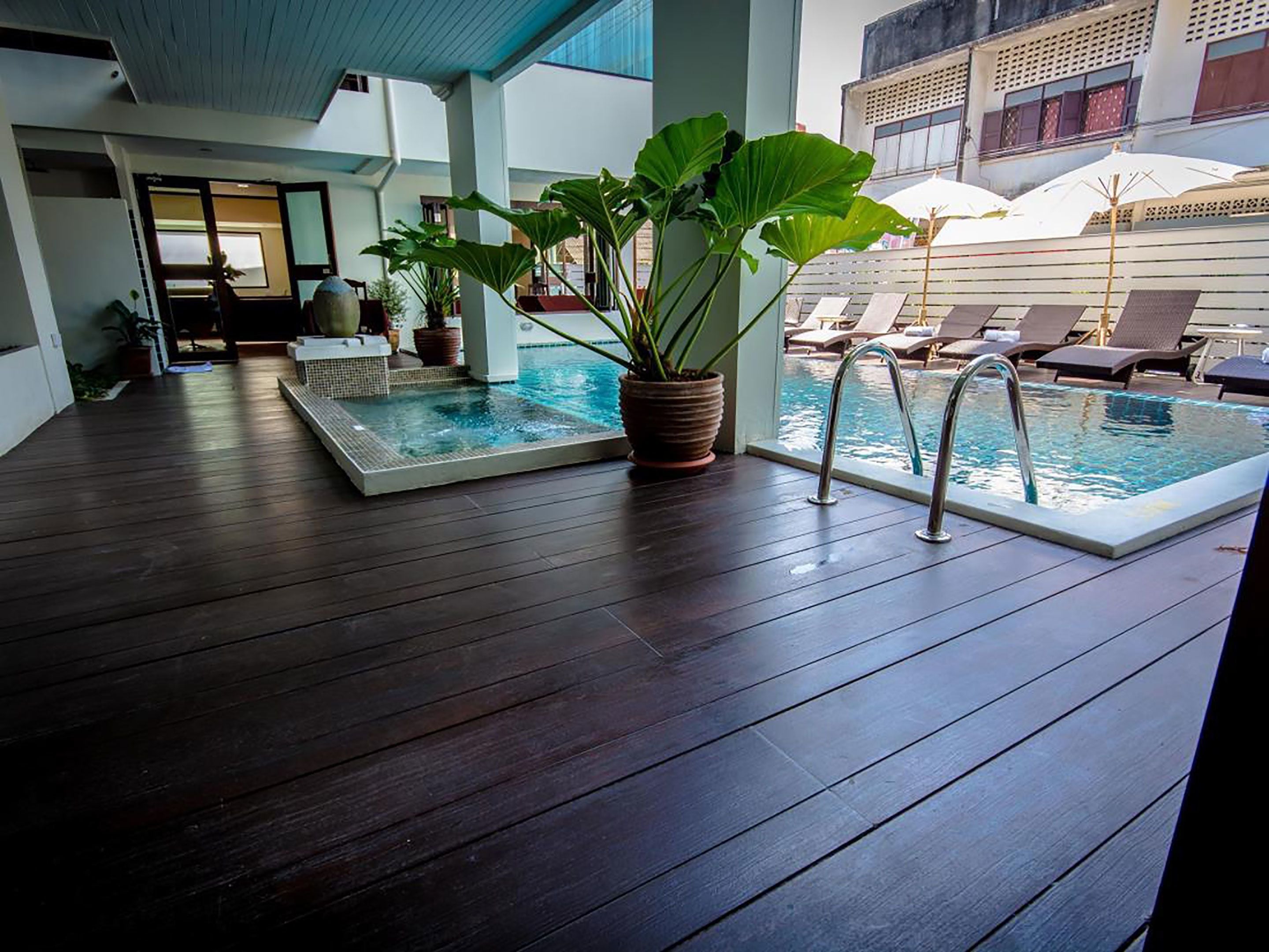 outdoor pool, pool umbrellas, pool loungers