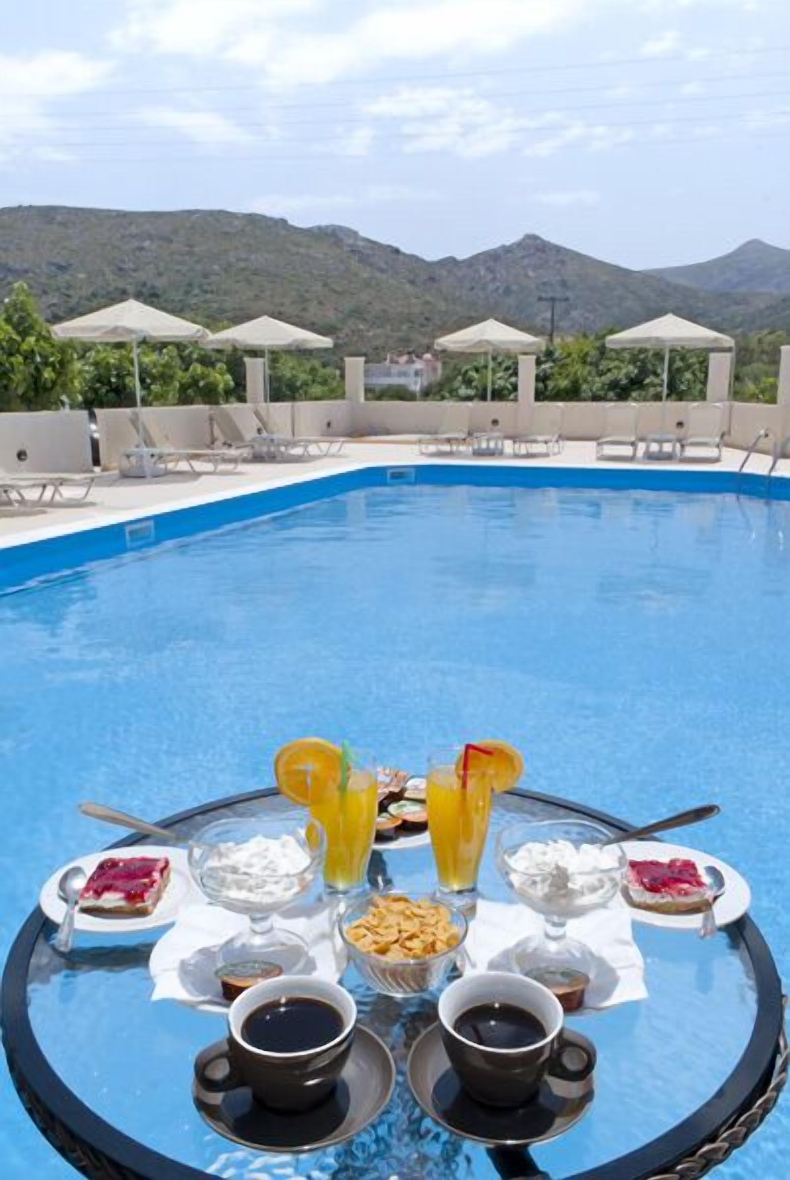 Seasonal outdoor pool, pool umbrellas, sun loungers