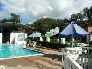 Outdoor pool, a waterfall pool, sun loungers