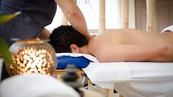 Experience a rejuvenating massage on a comfortable table with a soothing ambiance.