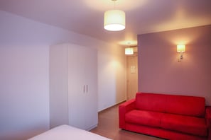 Quadruple Room | Living area | Flat-screen TV