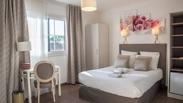 Standard Double Room | Minibar, in-room safe, individually decorated, desk