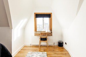 Desk, laptop workspace, free WiFi, bed sheets