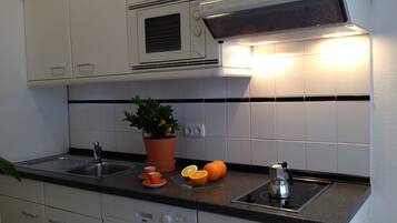 Apartment, 1 Bedroom | Private kitchen | Fridge, microwave, stovetop, dishwasher