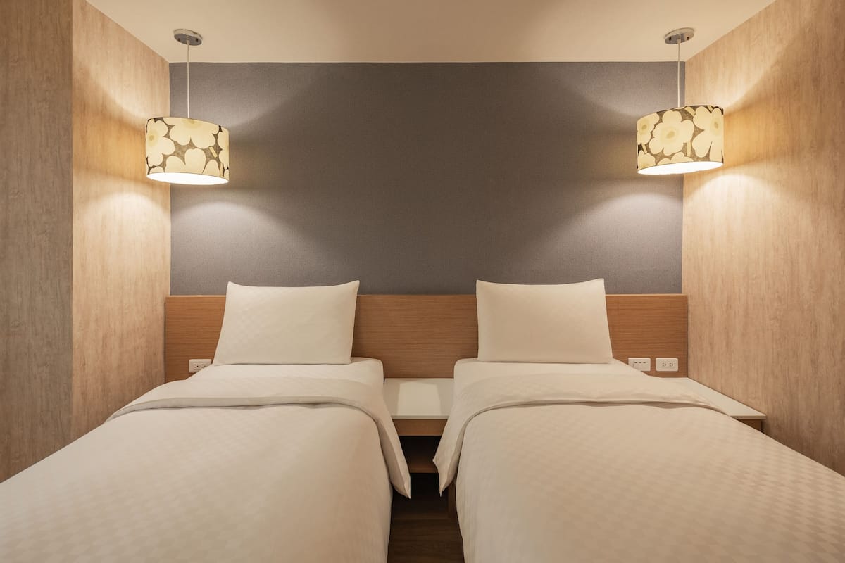 business twin room | down duvets, desk, blackout curtains, soundproofing