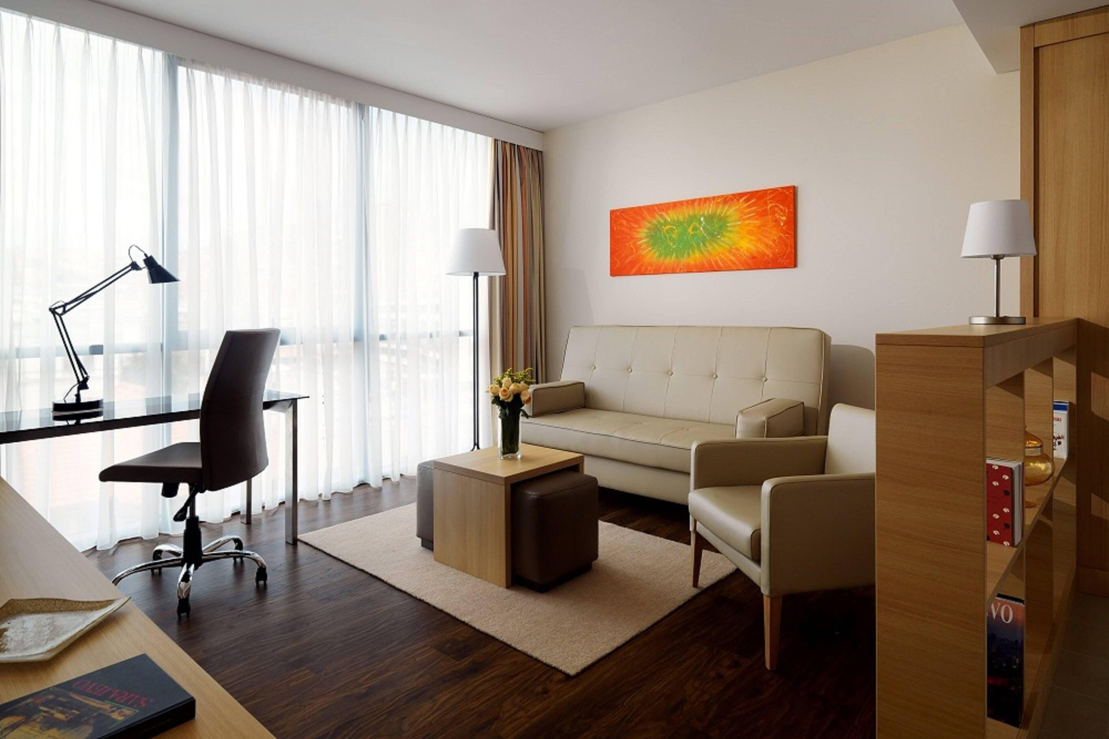 suite, 1 bedroom, city view | living area | 40-inch smart tv with cable channels, tv