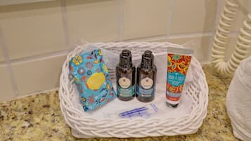 A basket containing toiletries on a kitchen counter.