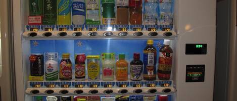 A vending machine with various beverages and snacks.