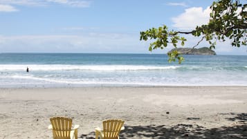 Beach nearby, white sand, beach towels