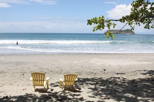 Beach nearby, white sand, beach towels