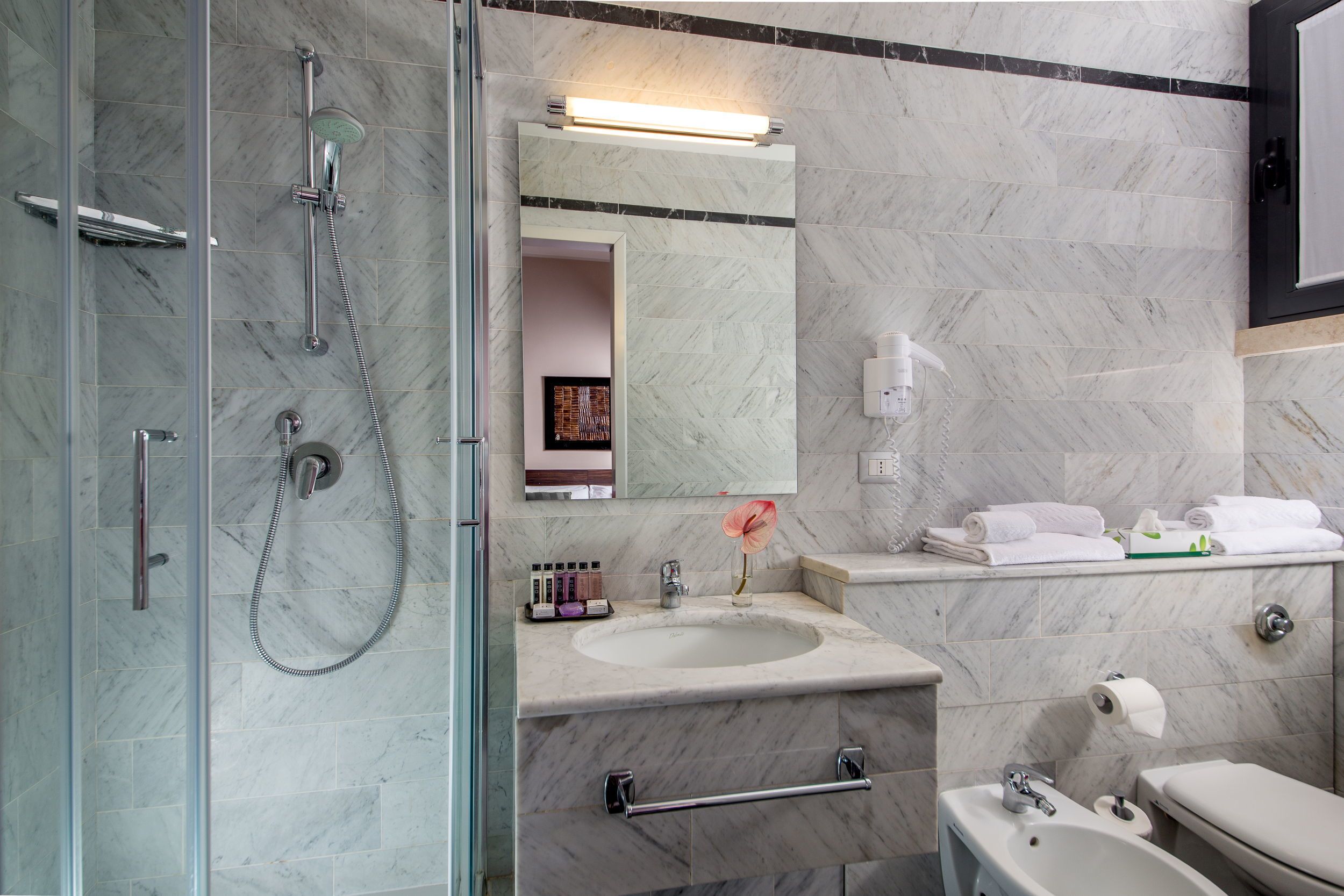 hair dryer, bidet, towels