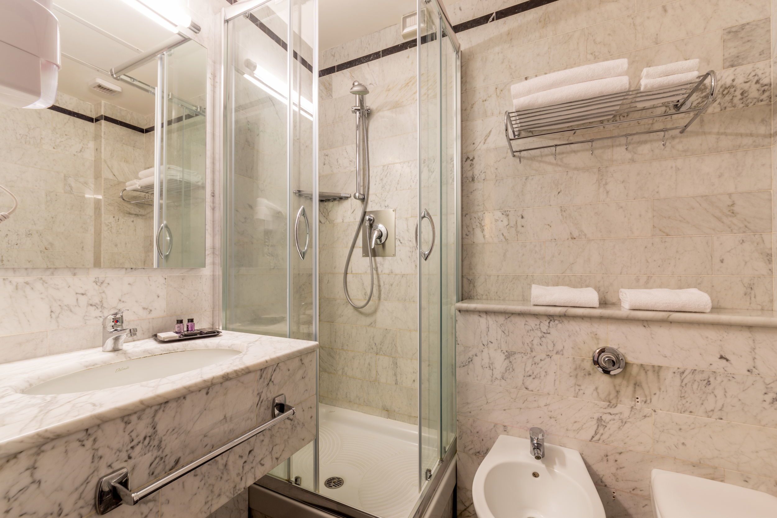 hair dryer, bidet, towels