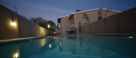 Outdoor pool, open 6:00 AM to 6:30 PM, pool umbrellas, pool loungers
