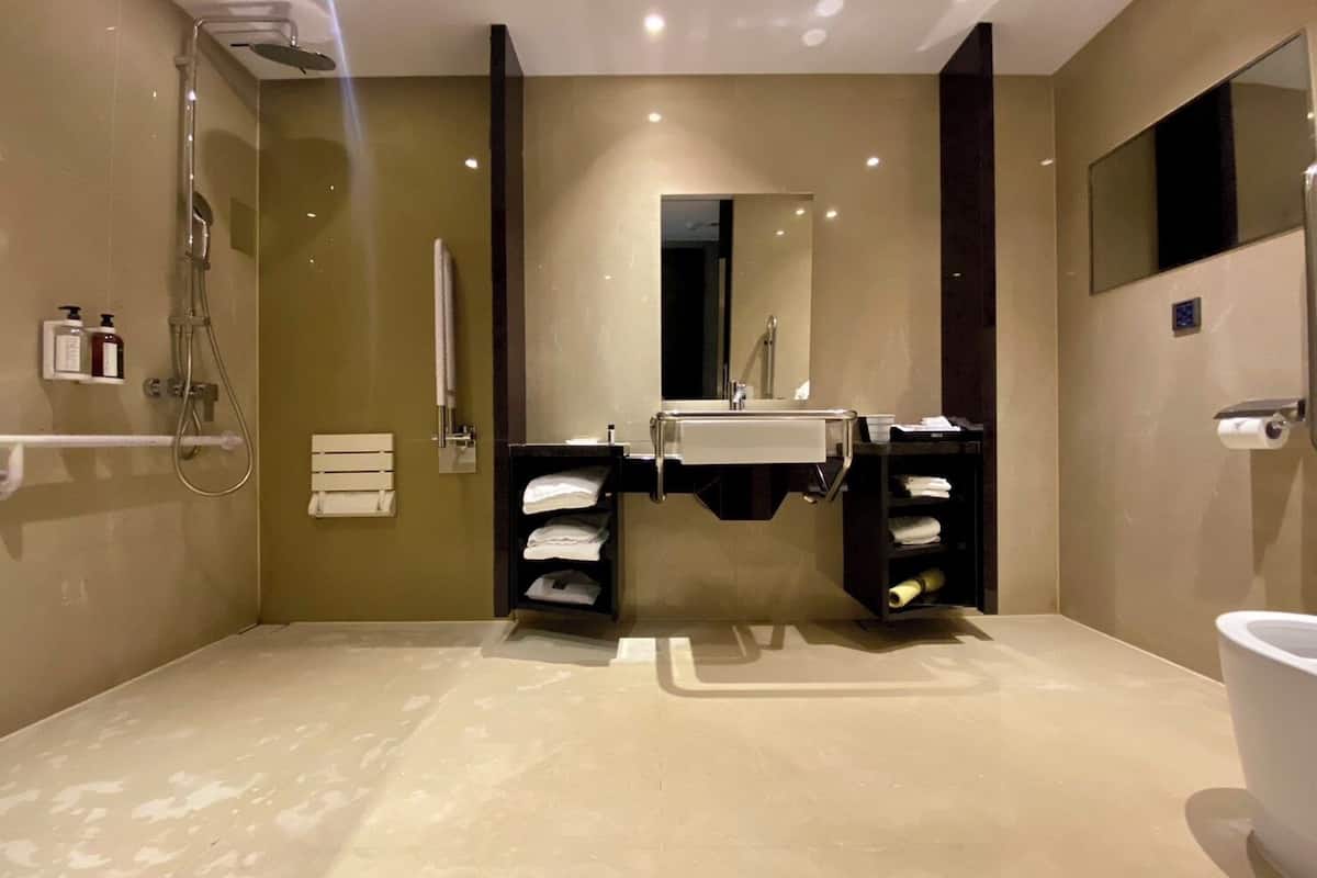 standard room - disability access | bathroom | eco-friendly toiletries, hair dryer, slippers, electronic bidet