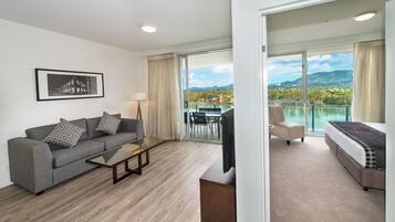 Two Bedroom Apartment, River View | Living room | Flat-screen TV