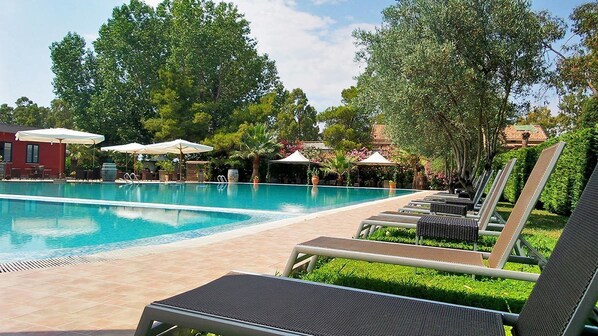 Seasonal outdoor pool, pool umbrellas, pool loungers