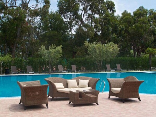 Seasonal outdoor pool, pool umbrellas, pool loungers