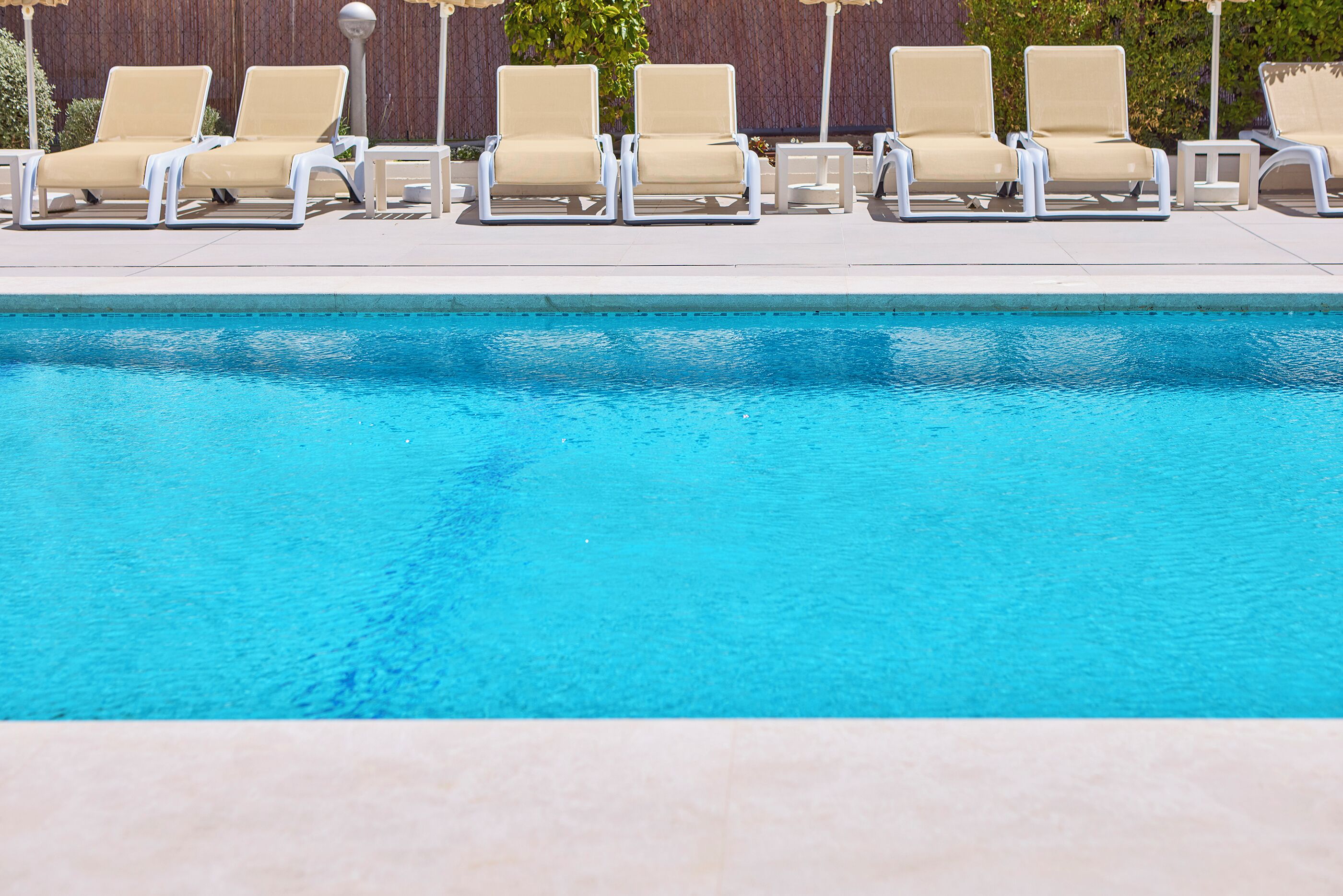 outdoor pool, pool umbrellas, pool loungers