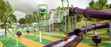 A water play area with slides and water jets.