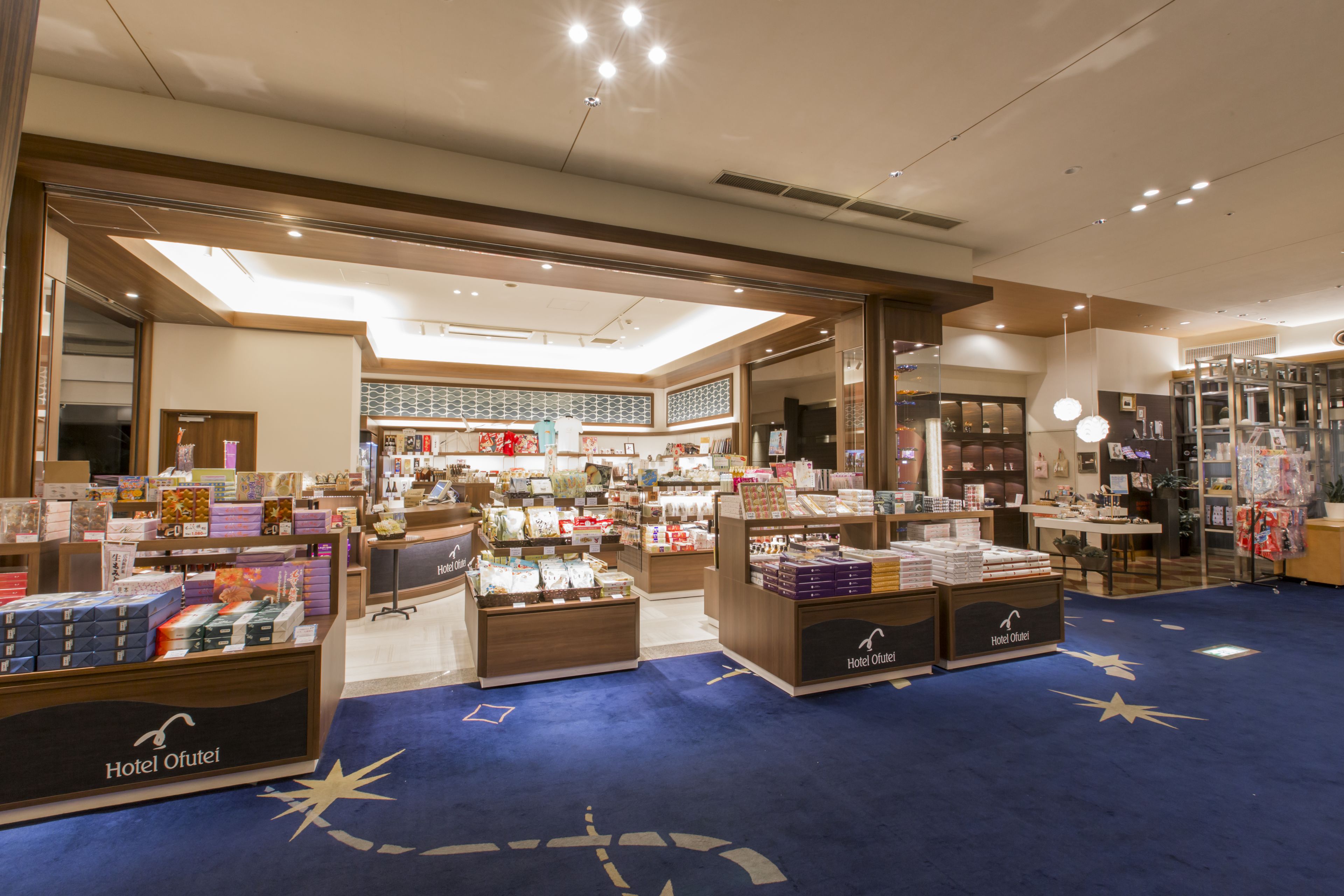 A hotel store with various products displayed on shelves and counters.