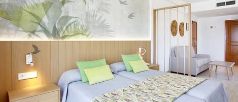 A modern bedroom with a bed, nightstands, a wall-mounted lamp, a wooden door, and a decorative wall piece.