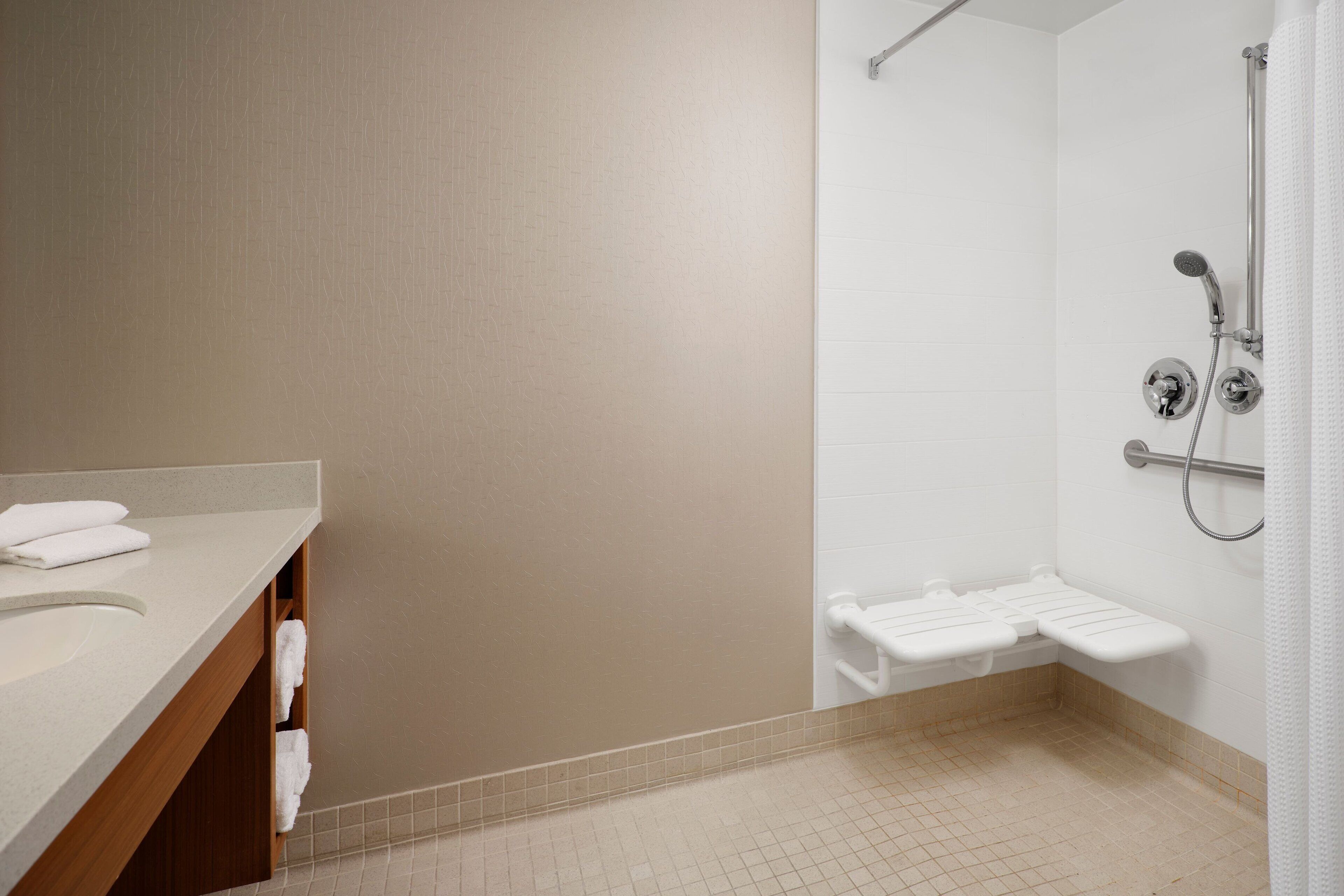 hair dryer, towels, toilet paper