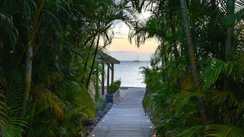On the beach, white sand, free beach cabanas, sun loungers