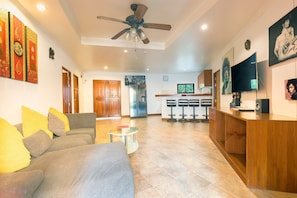Family Suite, 2 Bedrooms, Pool Access, Poolside | Living area | 34-inch flat-screen TV with cable channels, TV