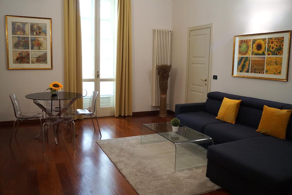 Superior Apartment | Living room | 12-inch flat-screen TV with digital channels, TV