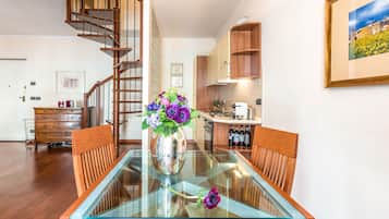 Deluxe Apartment | Living room | 12-inch flat-screen TV with digital channels, TV