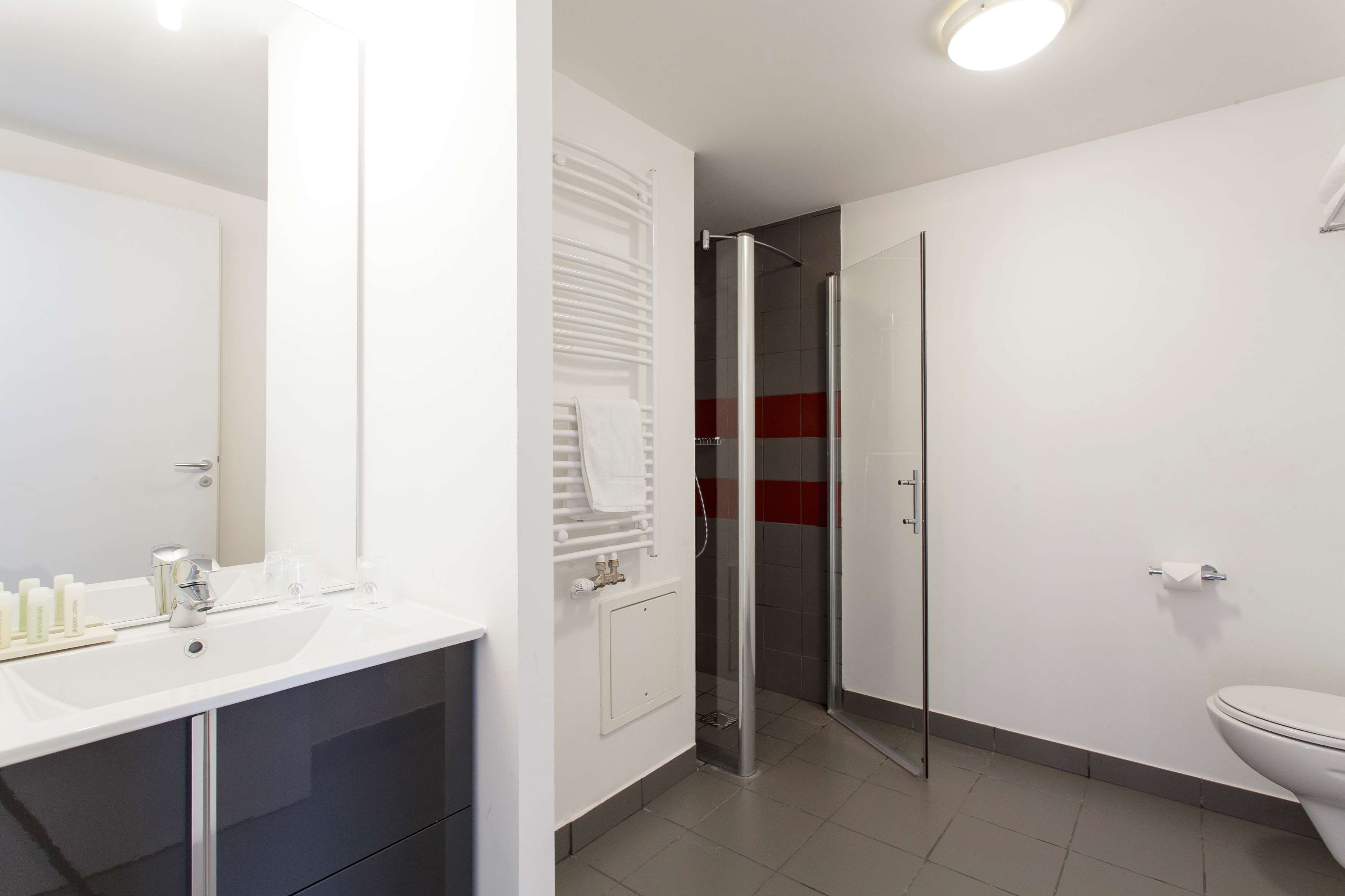 superior studio, 1 queen bed, kitchenette | bathroom | shower, eco-friendly toiletries, hair dryer, towels