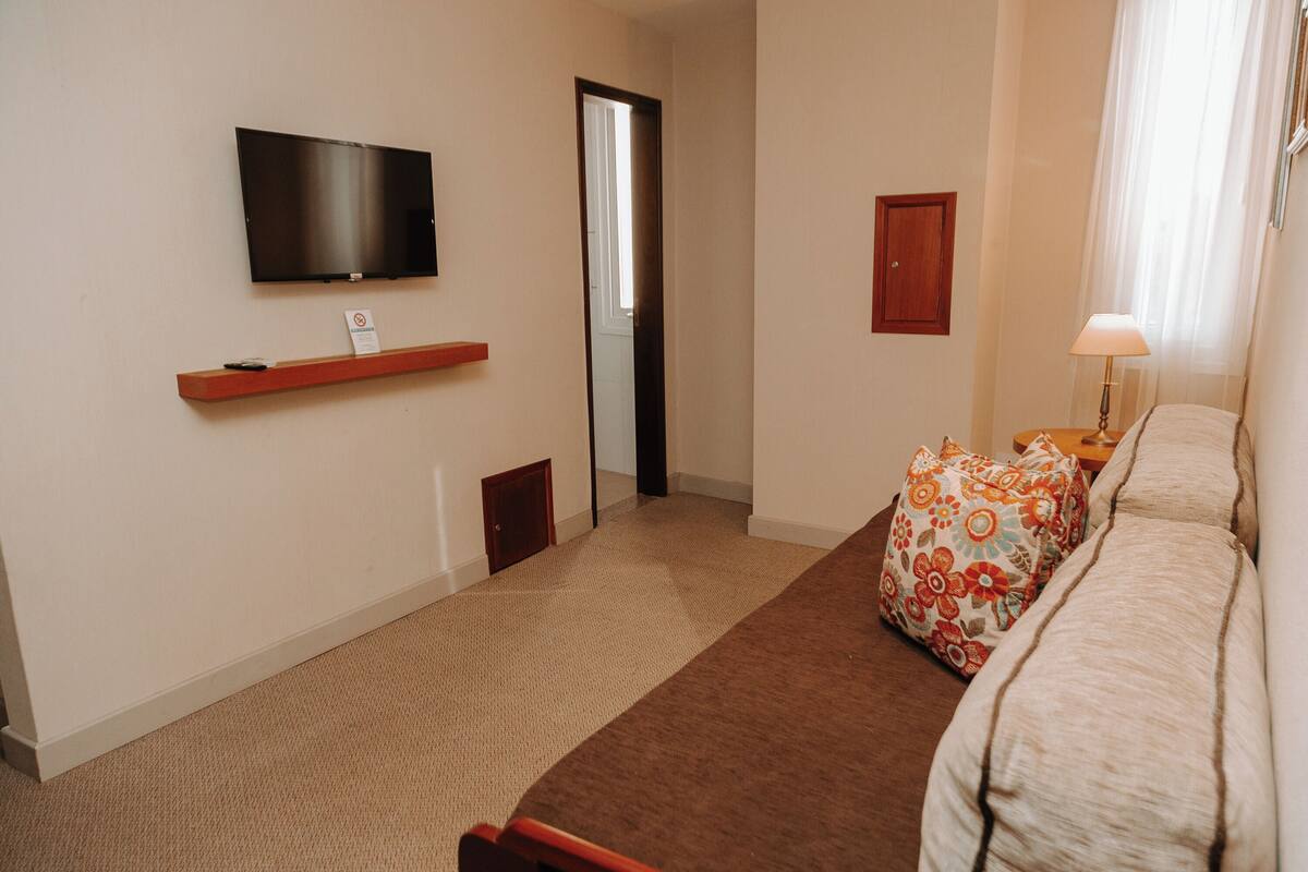 suite, 1 king bed, non smoking | minibar, in-room safe, desk, blackout curtains