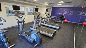 A gym with treadmills, elliptical machines, and weight machines. - Holiday Inn Express & Suites Ann Arbor West by IHG (Dexter)