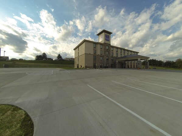 A large, multi-story hotel with a prominent tower and a covered entrance.