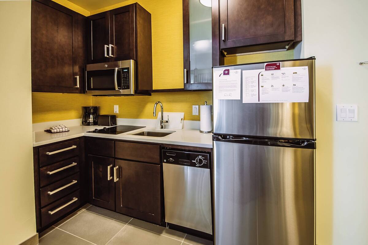 full-sized fridge, microwave, stovetop, dishwasher