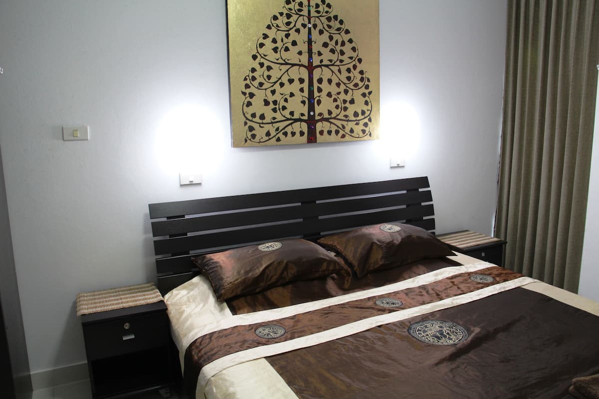 Comfort Apartment, 2 Bedrooms, Partial Sea View | 2 bedrooms, in-room safe, desk, iron/ironing board