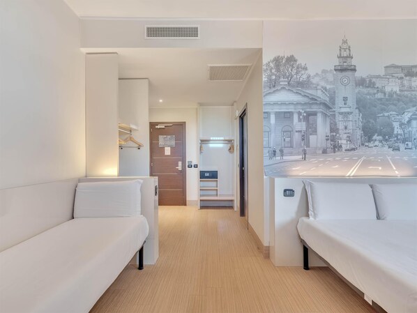 Triple Room | 1 bedroom, in-room safe, desk, blackout drapes