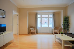 Family Apartment, 4 Bedrooms (1014) | Living area | Flat-screen TV